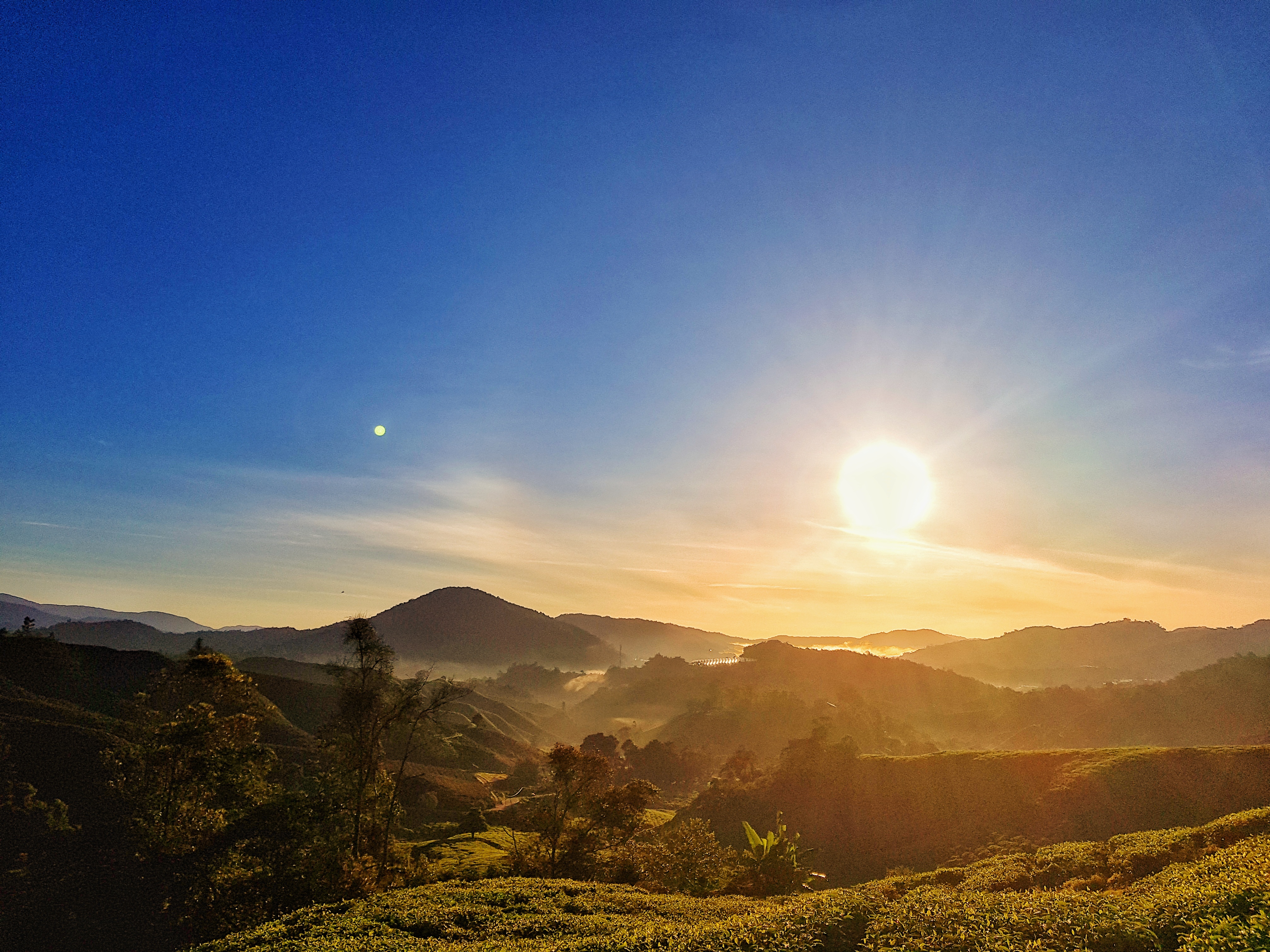 Sunrise with mist covering hills